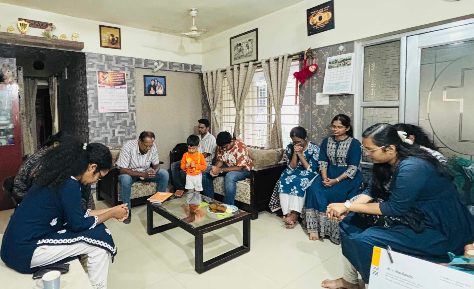 Praying together at the West Zone HUB